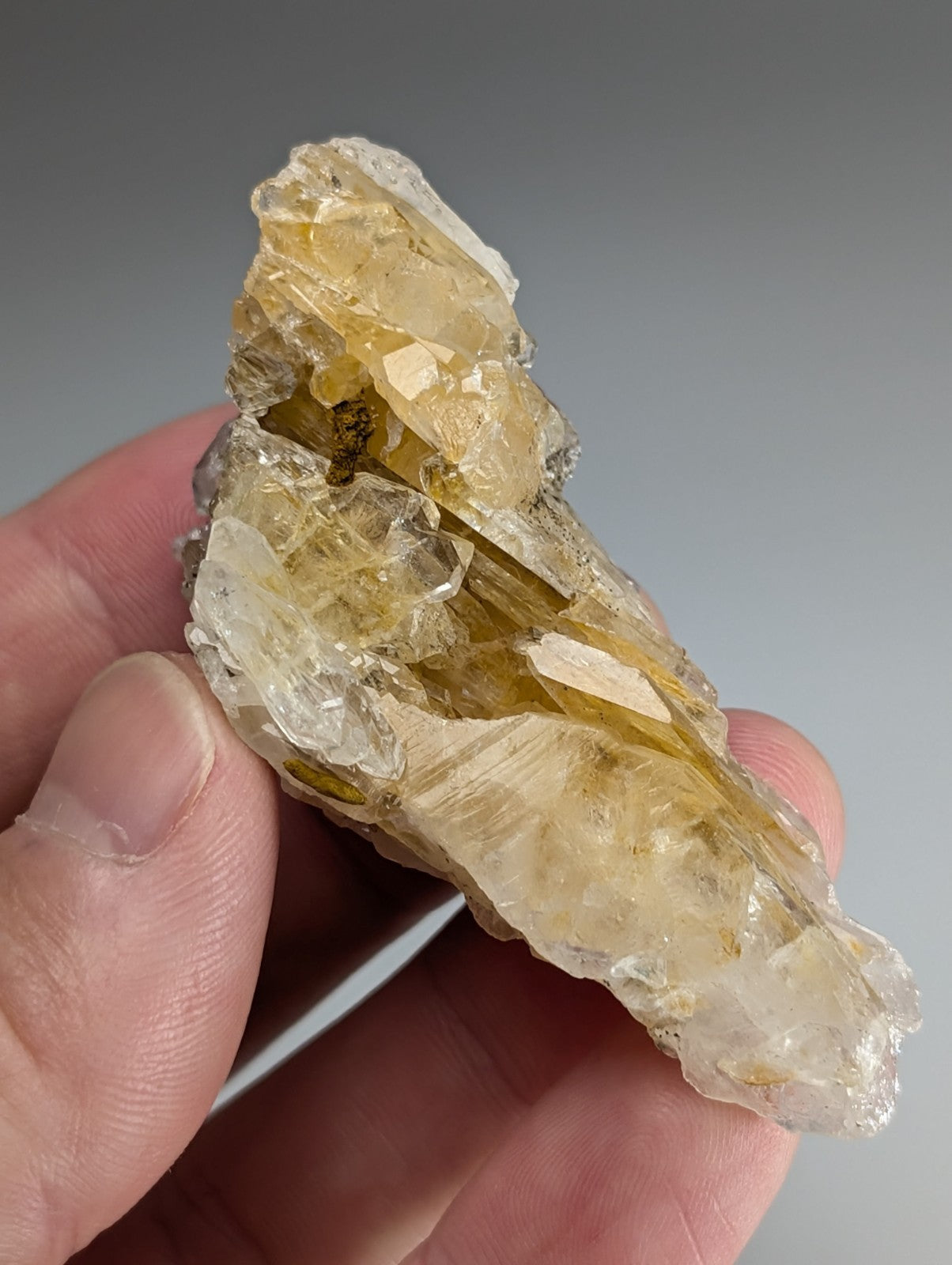 Parallel growth quartz crystal cluster from Saline County Arkansas with translucent yellowish rough surface and internal inclusions