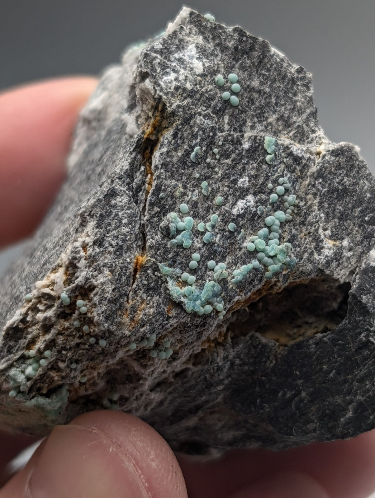 Planerite set of 2 featuring clusters of light green crystalline formations on dark gray rock from mauldin mountain