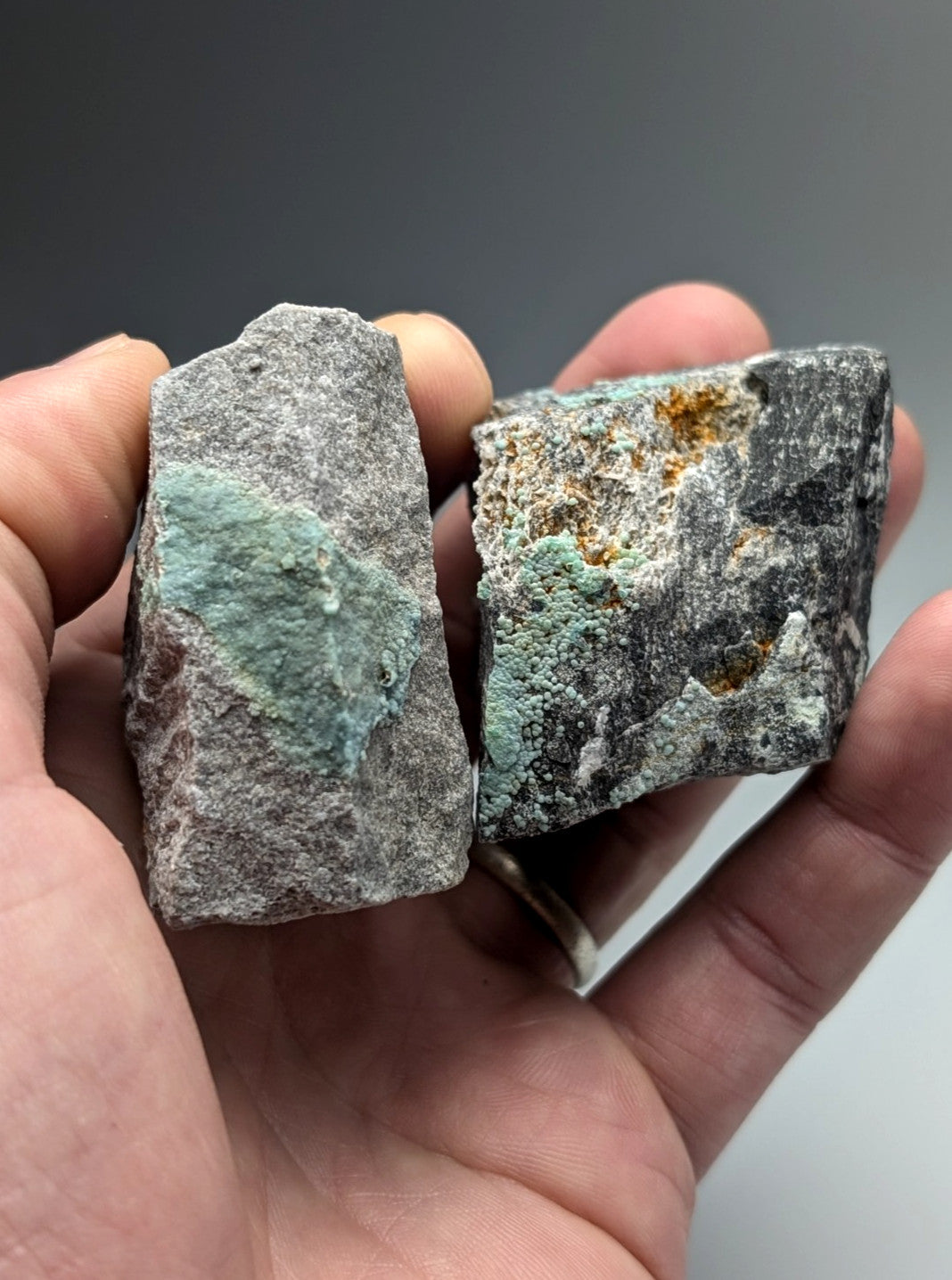 Two rough planerite mineral rocks with gray base and turquoise-green patches from mauldin mountain arkansas uv reactive