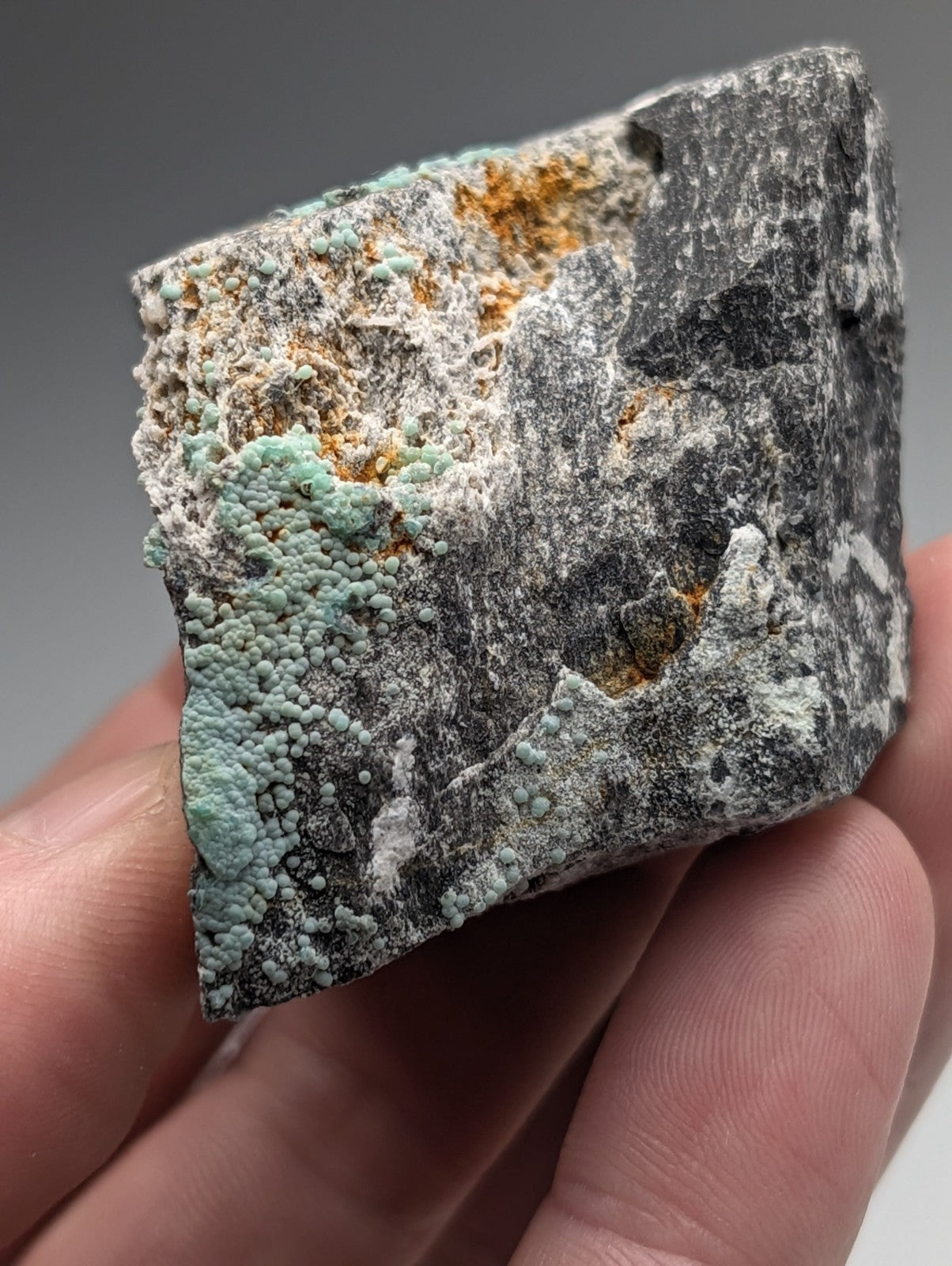 Planerite set of 2 mineral specimens from Mauldin Mountain Arkansas with dark gray base and turquoise orange uv reactive patina