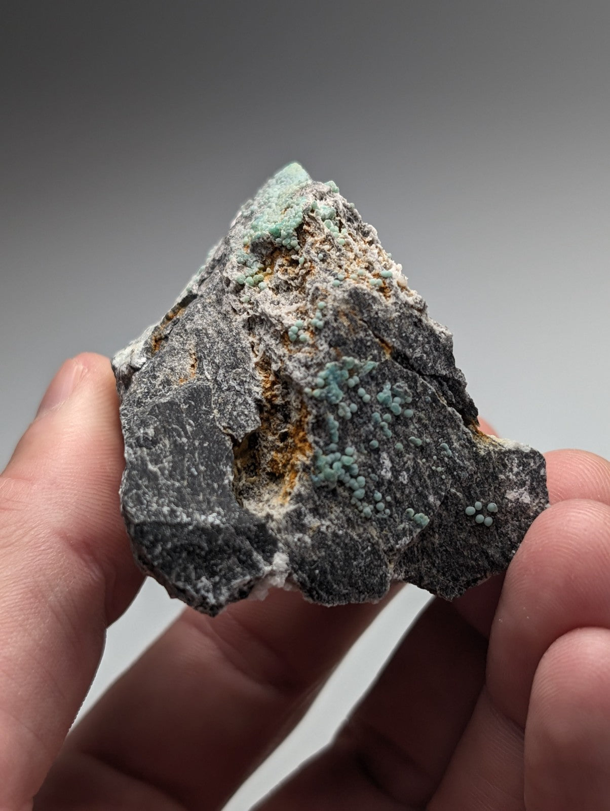 Planerite set of 2 rough dark gray rocks with vibrant green mineral patches and white orange speckles from arkansas uv reactive