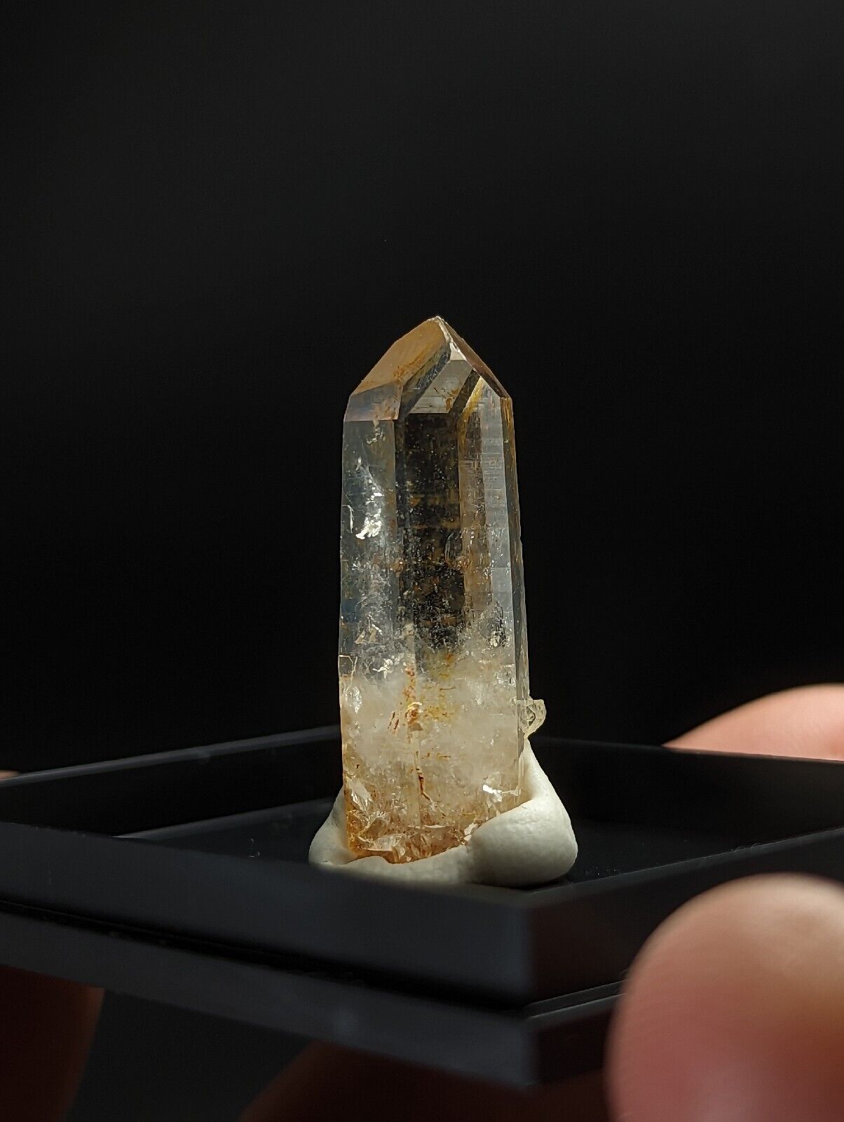 Translucent quartz crystal with a pointed tip.