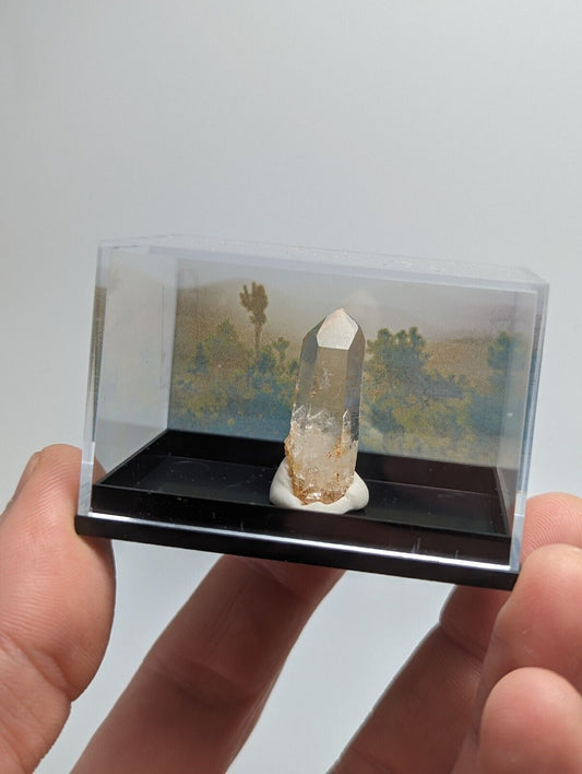 Quartz crystal in display case.