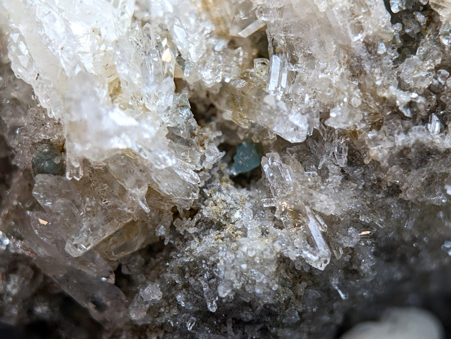 Quartz crystal cluster with translucent crystals and blue-green cookeite inclusions from saline county arkansas