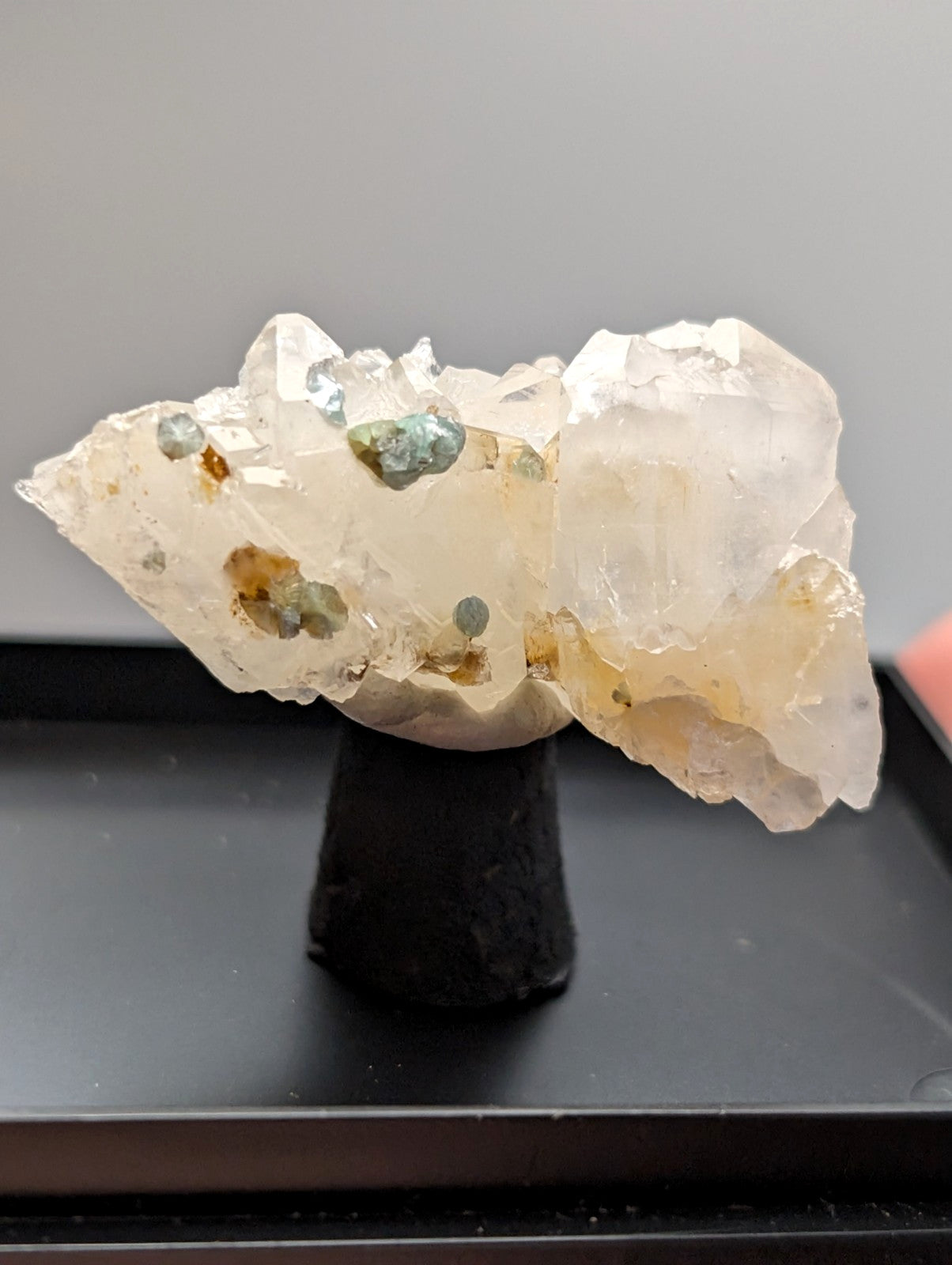 Translucent pale yellow quartz crystal cluster with blue-green cookeite and brown mineral inclusions from arkansas
