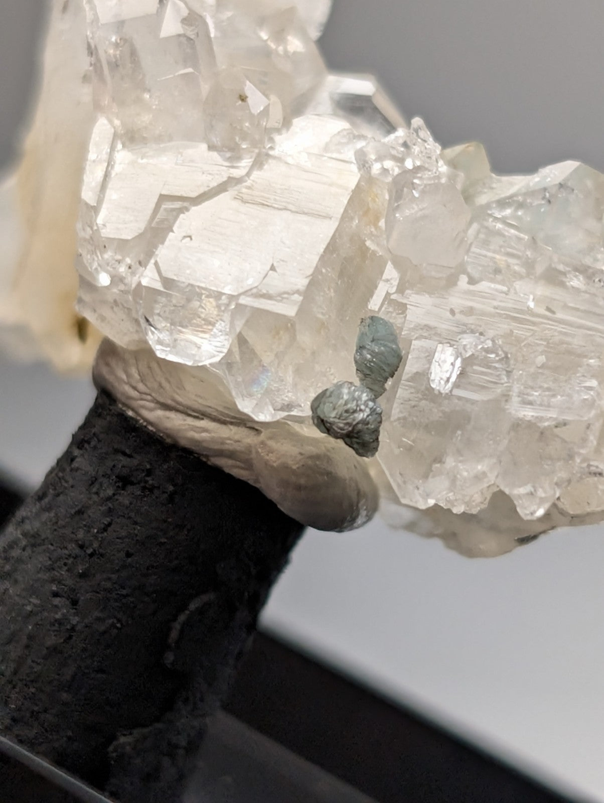 Quartz crystal cluster with blue-green cookeite from saline county Arkansas featuring small mossy growths