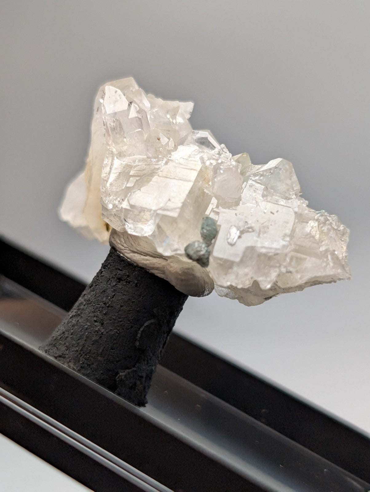 Quartz crystal cluster with blue-green cookeite from saline county Arkansas showing translucent pale facets