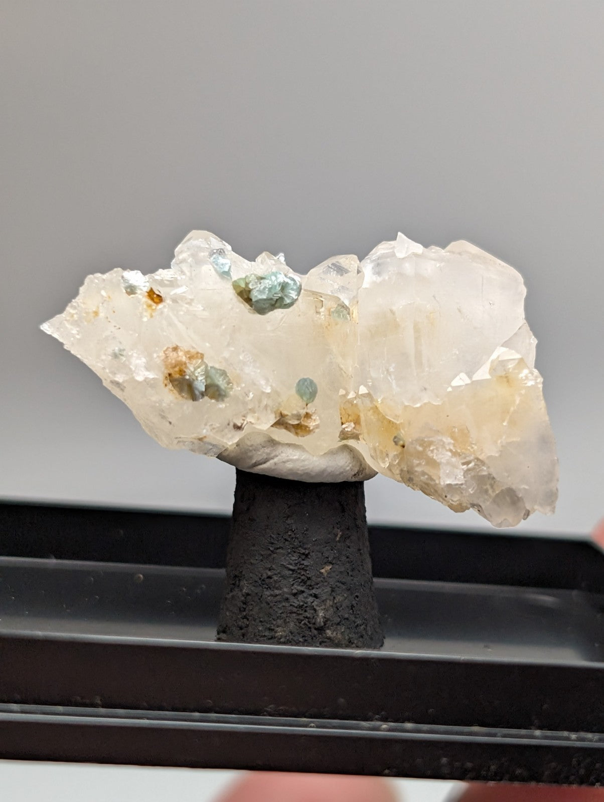 Quartz crystal cluster with blue-green cookeite from Saline County Arkansas showing pale yellowish-white mineral with inclusions