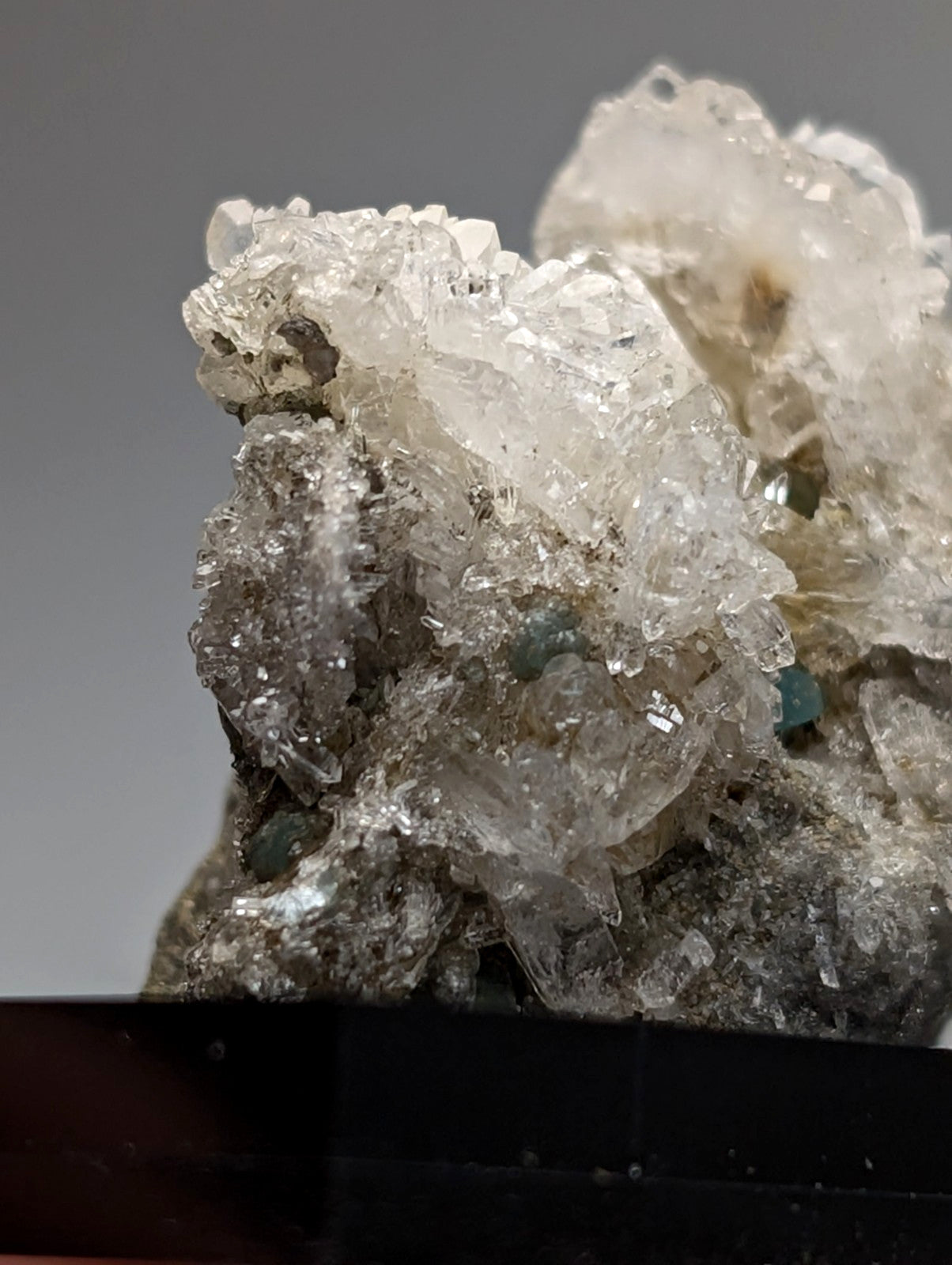 Quartz crystal cluster with blue-green cookeite from saline county Arkansas featuring translucent clear quartz formations