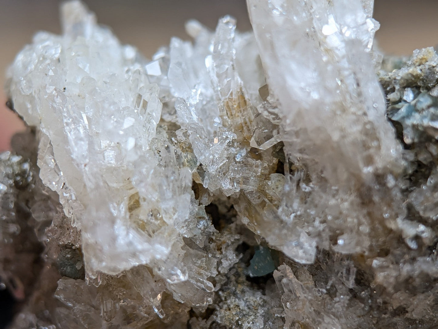Quartz crystal cluster with blue-green cookeite from Saline County Arkansas featuring translucent pale yellow crystals