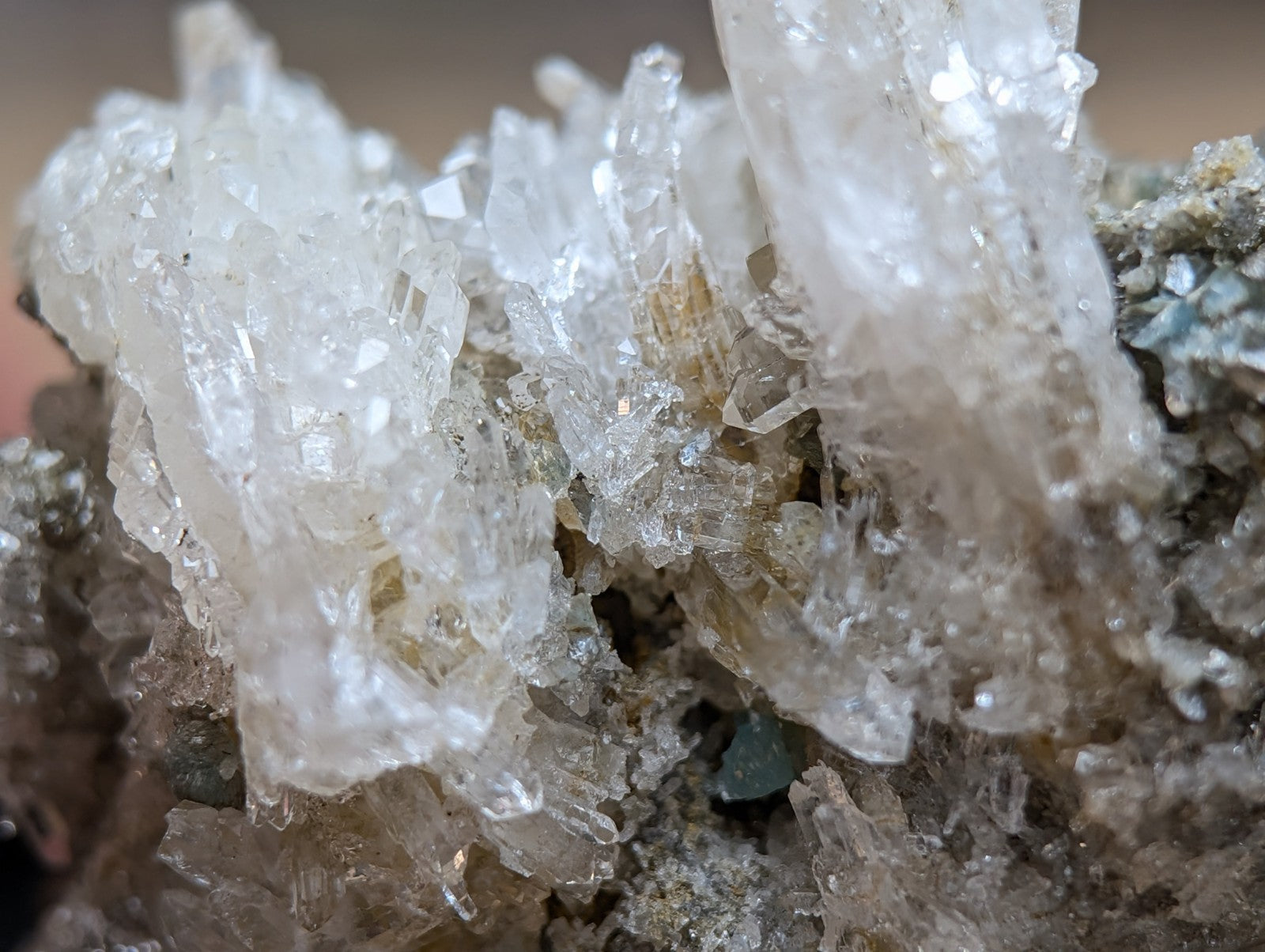 Quartz crystal cluster with blue-green cookeite from Saline County Arkansas featuring translucent pale yellow crystals