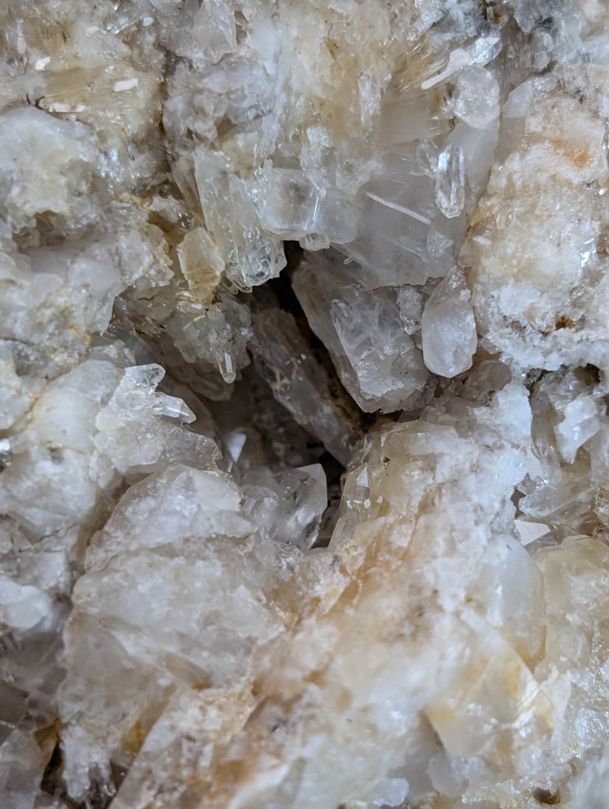 Quartz crystal cluster with translucent clear points and subtle golden-yellow veining from Saline County Arkansas