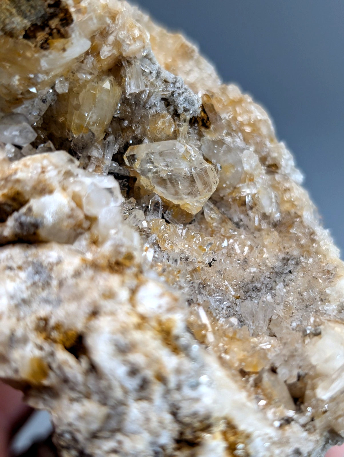 Translucent golden quartz crystal cluster with solution quartz and cookeite on earthy matrix from saline county arkansas