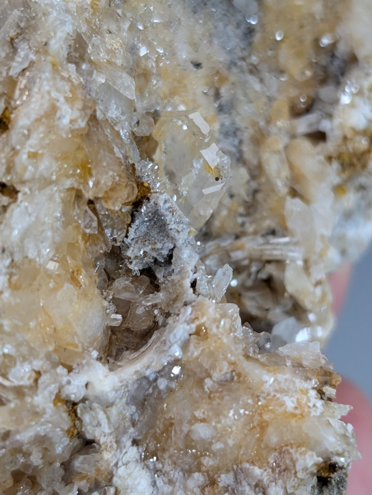 Quartz crystal cluster with translucent clear and amber solution quartz intergrown with grayish cookeite matrix from Arkansas