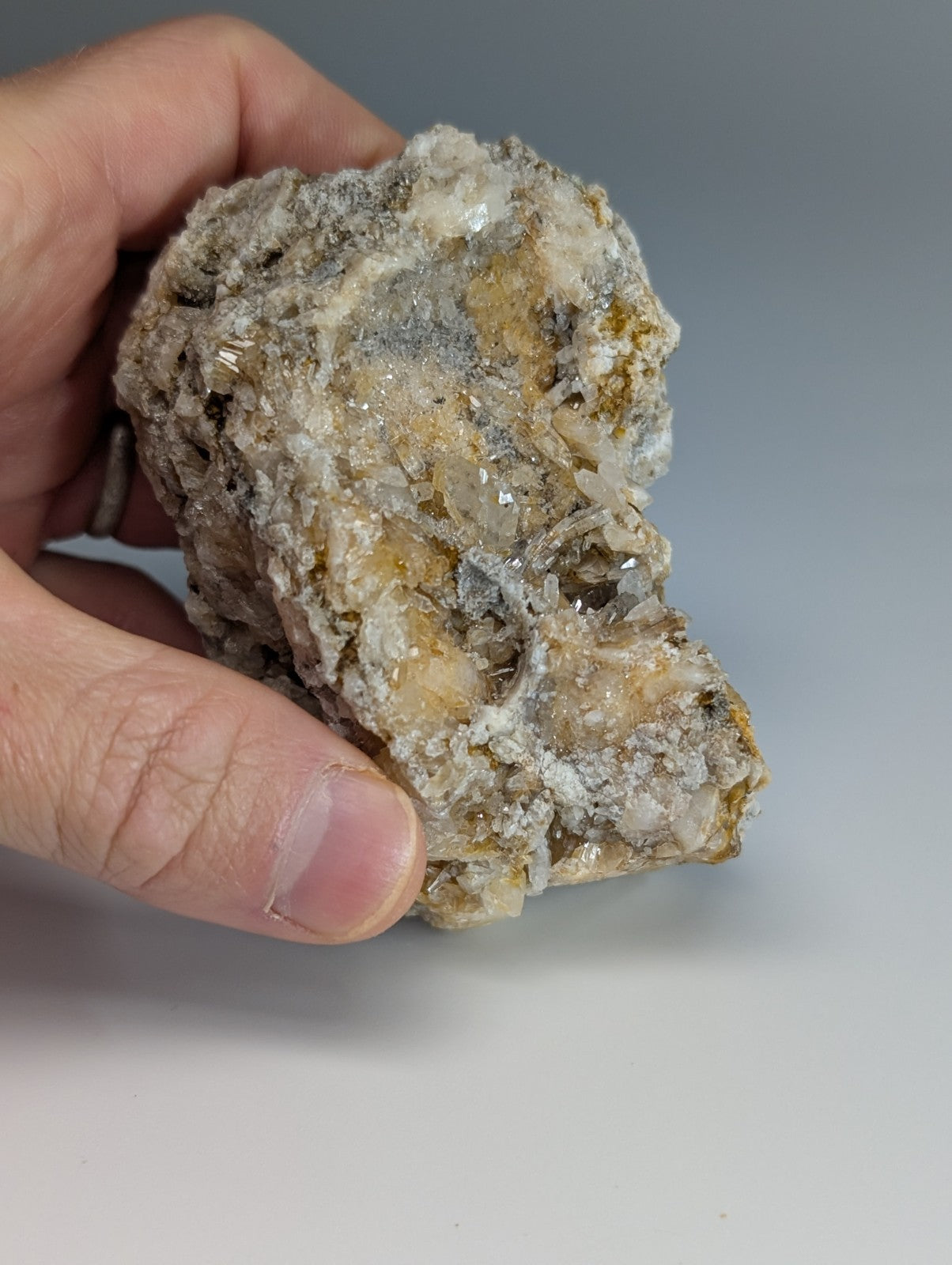 Quartz crystal cluster with solution quartz and cookeite featuring translucent crystals in gray and yellowish matrix from arkansas