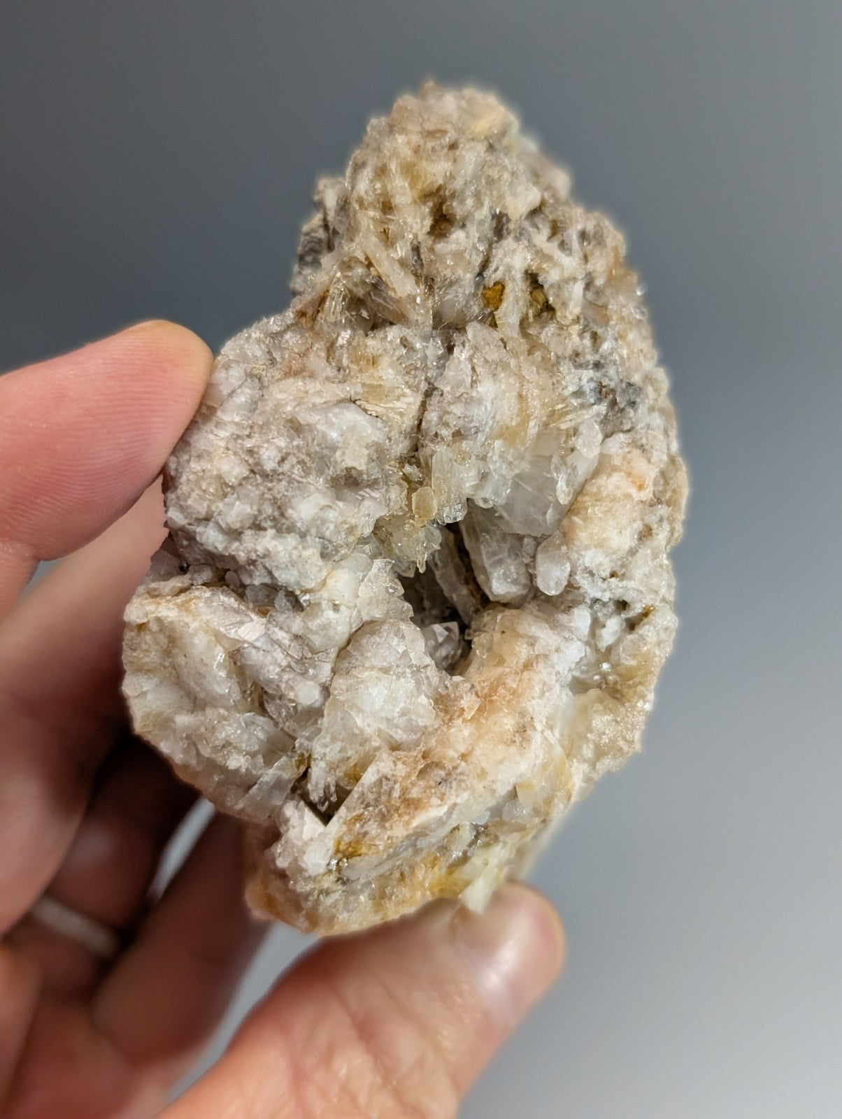 Rough quartz crystal cluster with translucent white solution quartz and pale yellow cookeite in dark matrix from arkansas