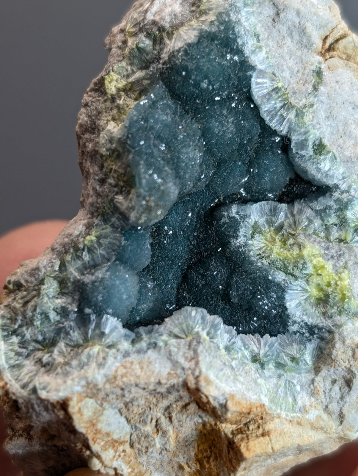 A rare blue and green wavellite geode with dark blue sparkling interior and white crystals from garland county arkansas