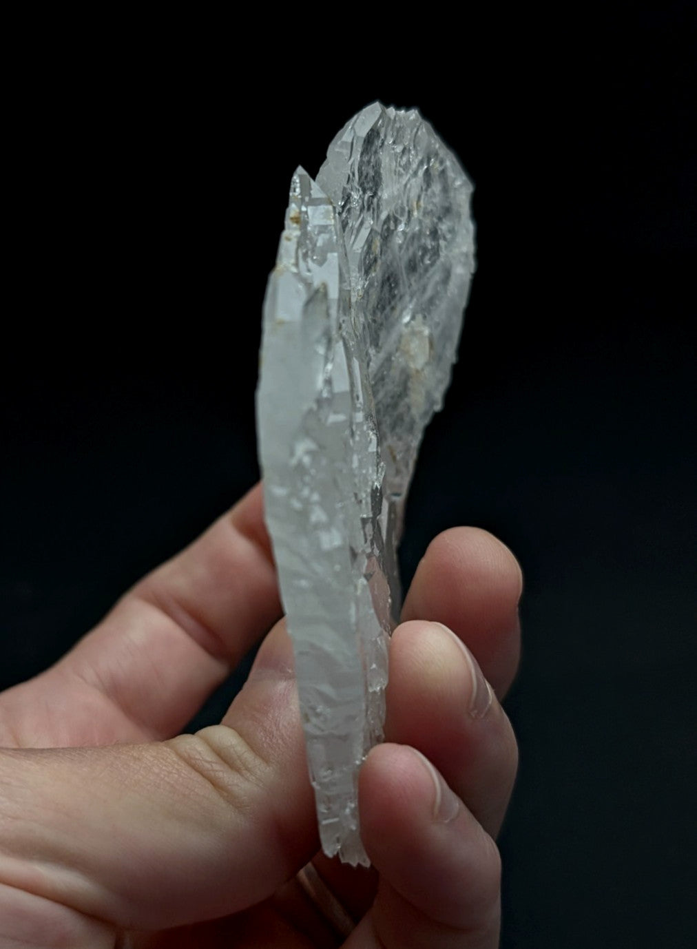 A translucent crystalline faden sheet quartz crystal cluster with jagged natural edges and internal striations from Arkansas usa