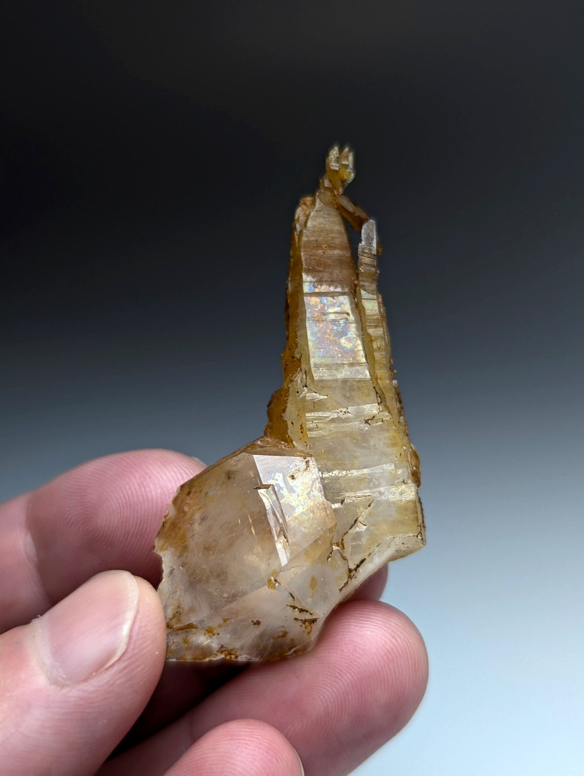 A rare and unique translucent golden-yellow quartz crystal with jagged multi-faceted structure from garland county arkansas