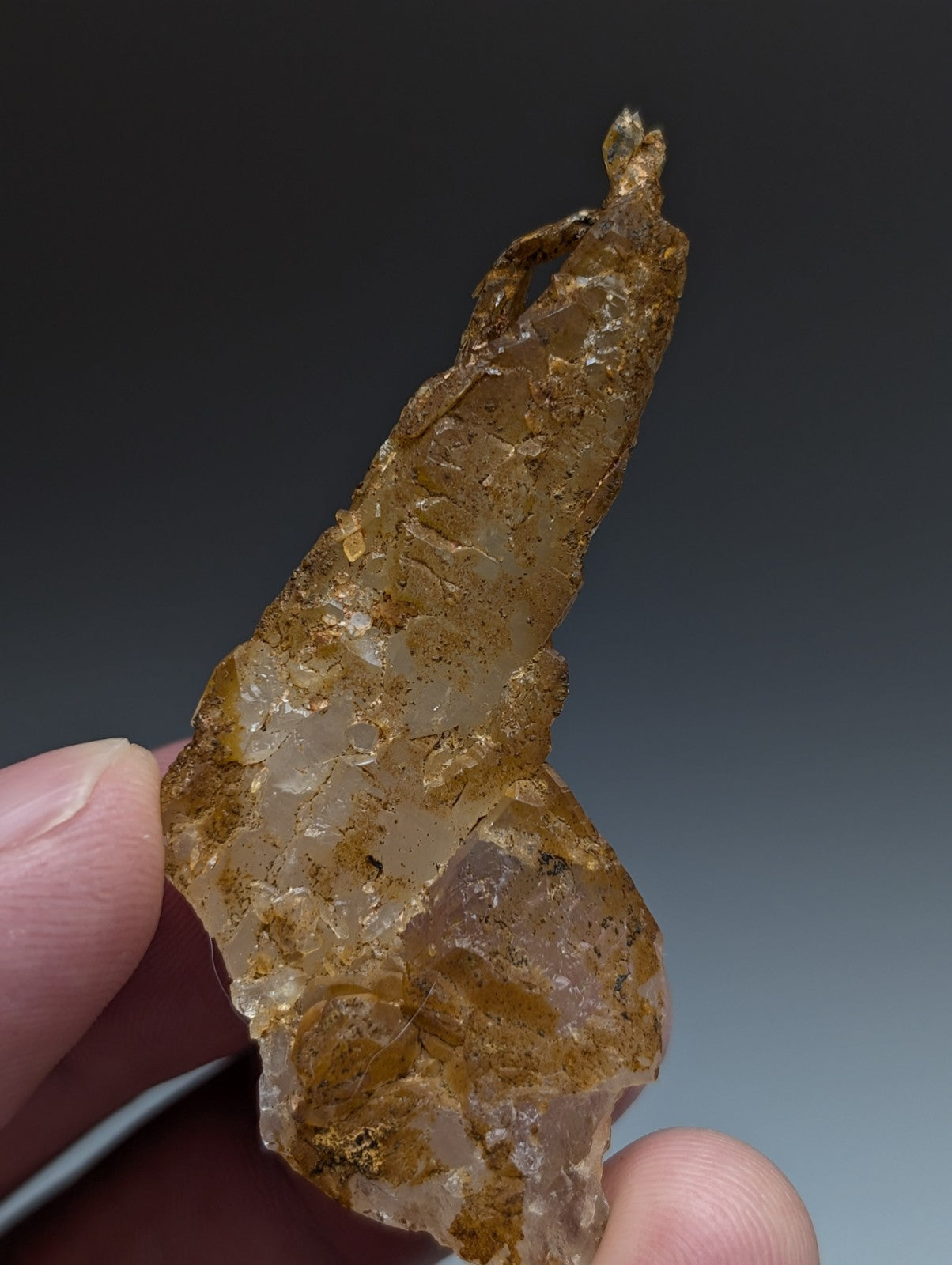 A rare and unique translucent amber quartz crystal oddity with rough surface and internal inclusions from Arkansas usa