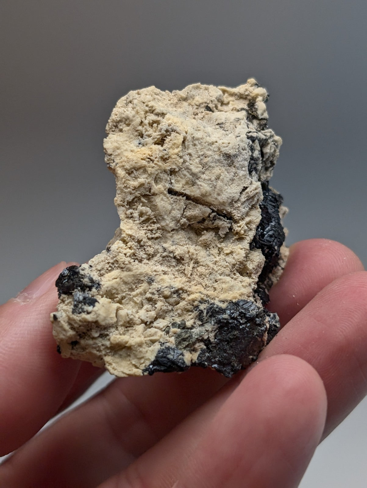Rough irregular black and beige rutile in matrix mineral cluster from magnet cove arkansas super rare old stock
