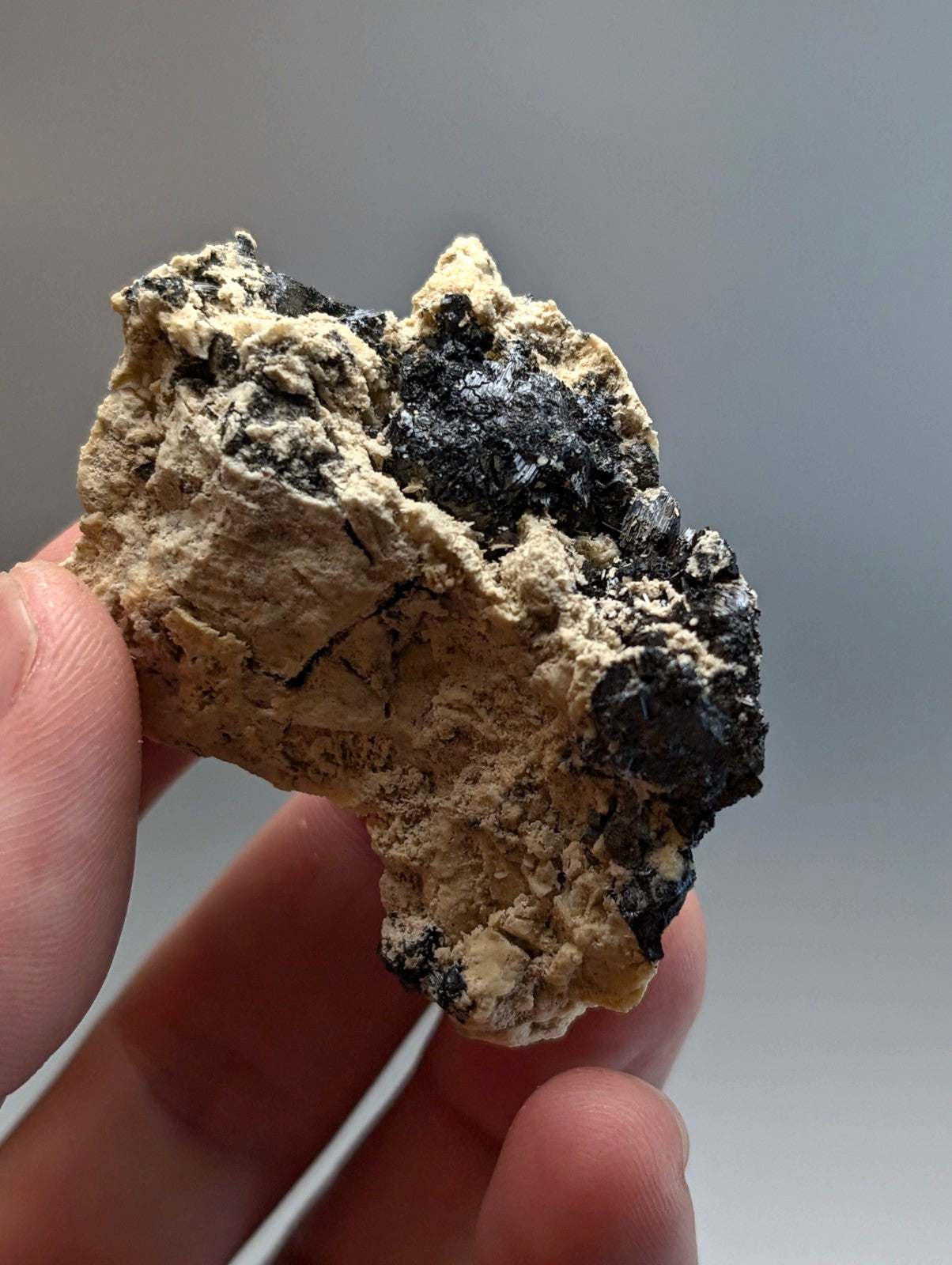 Rugged rutile in matrix mineral with beige base and black inclusions from magnet cove arkansas beautiful rare cluster