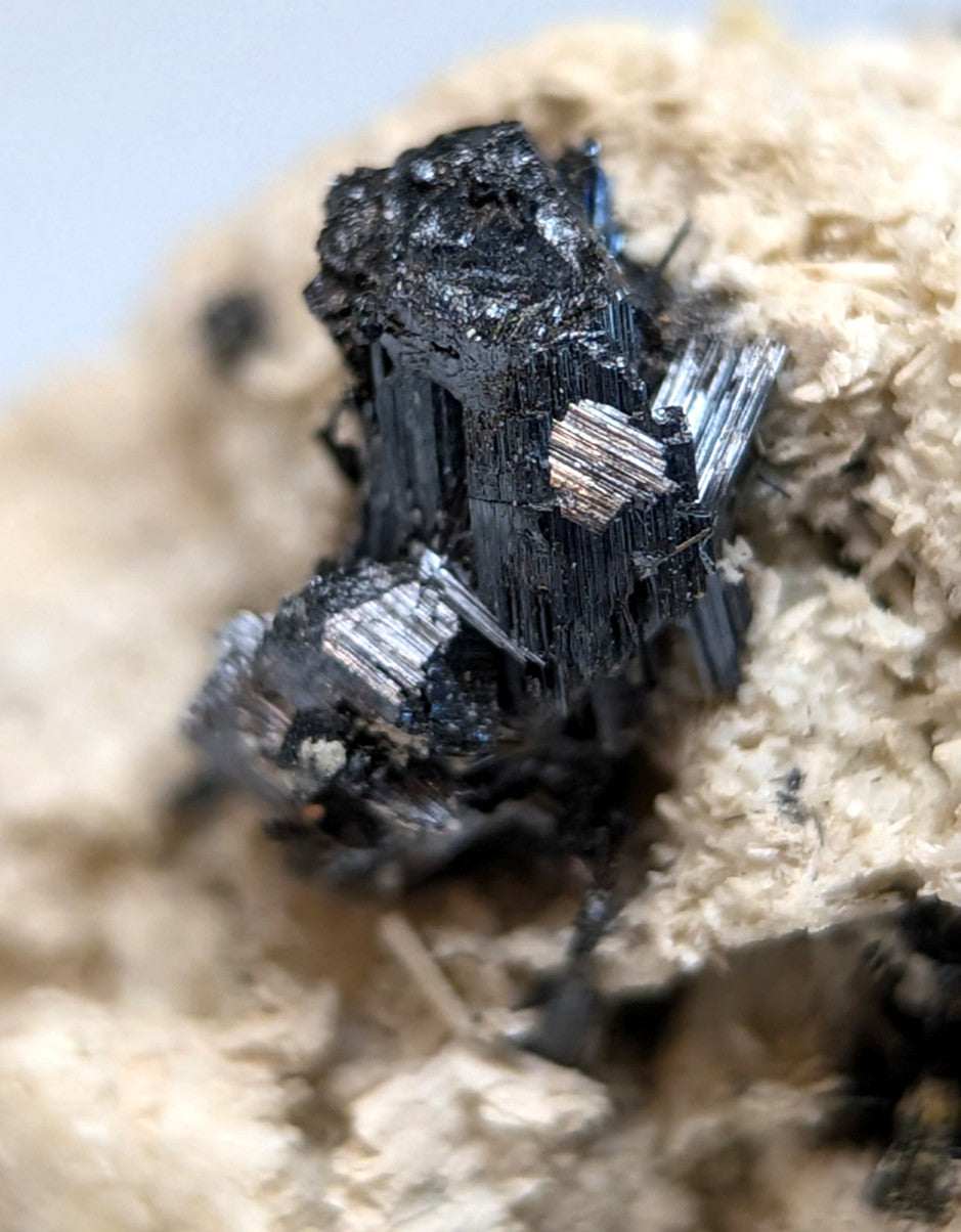 A cluster of dark metallic rutile crystals with sharp edges in matrix from magnet cove arkansas super rare old stock