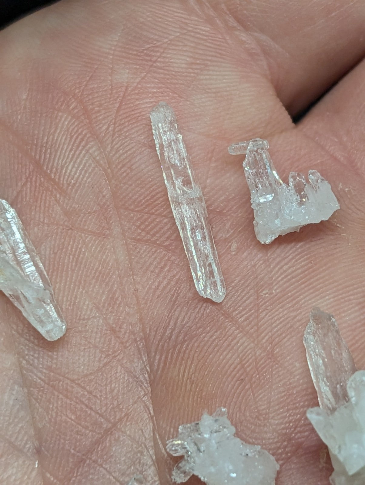Clear, translucent quartz crystals with jagged edges and natural facets.