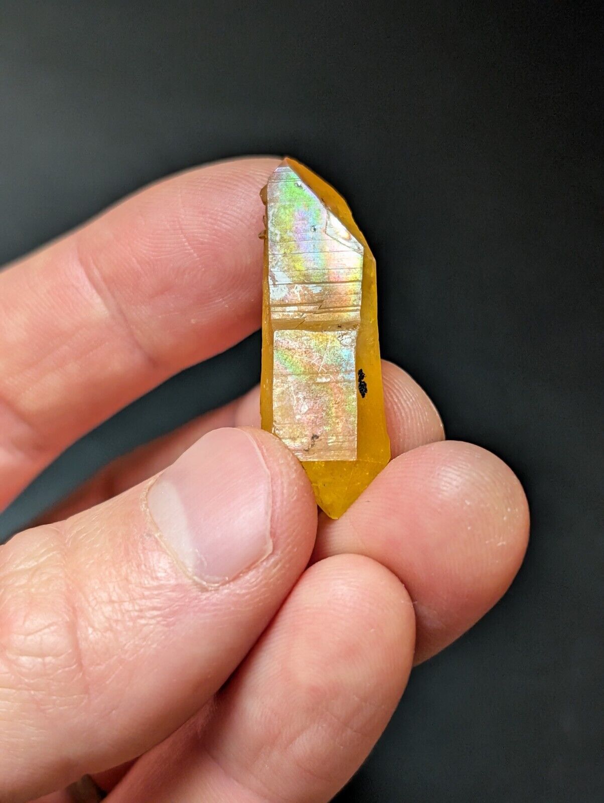 Iridescent yellow crystal point.