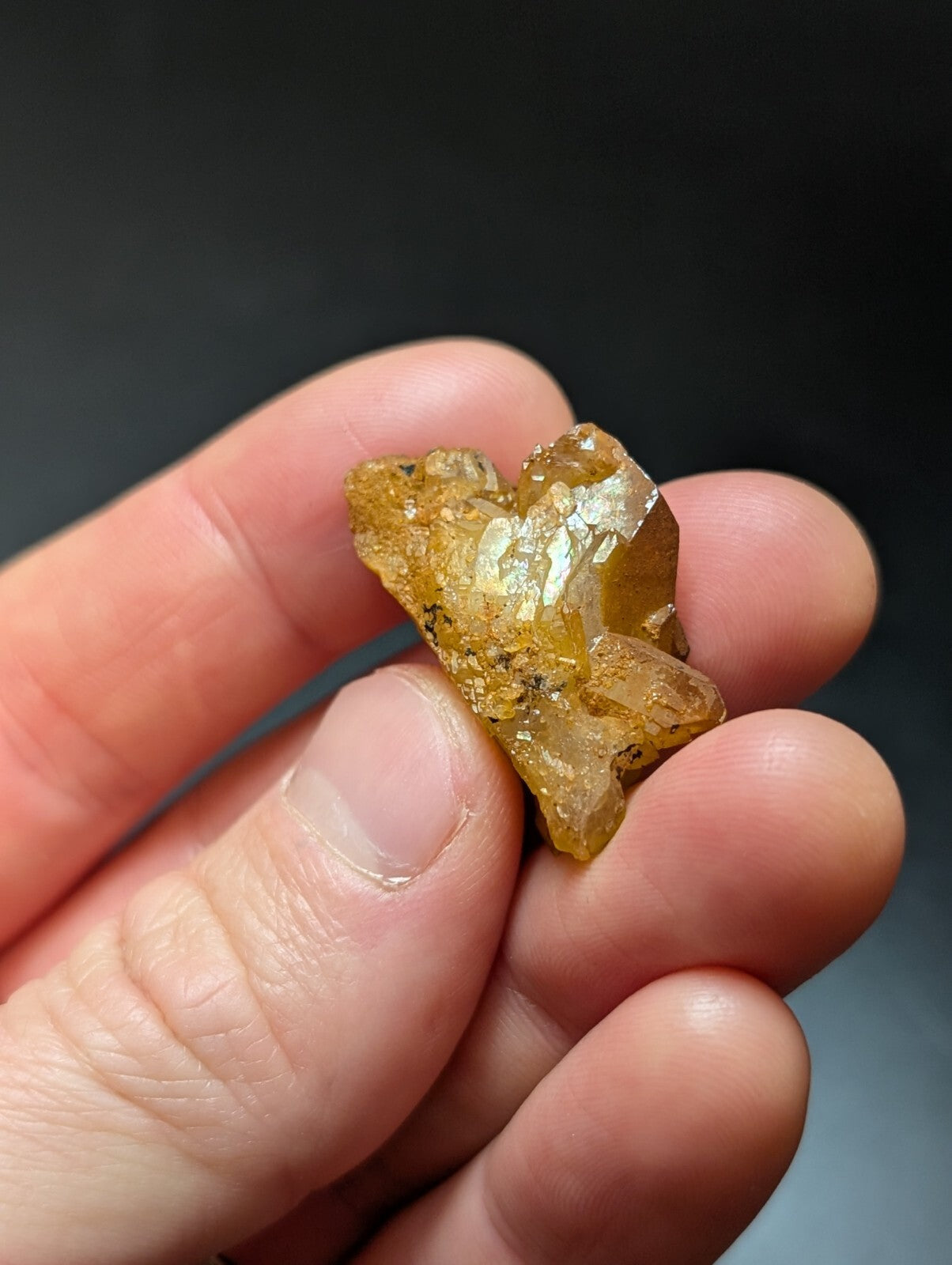 A translucent golden-yellow crystal cluster with sharp, faceted edges and a slightly rough texture.