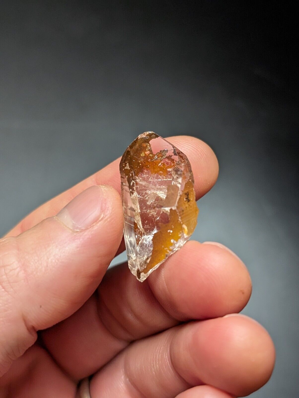 Translucent, amber-colored crystal.
