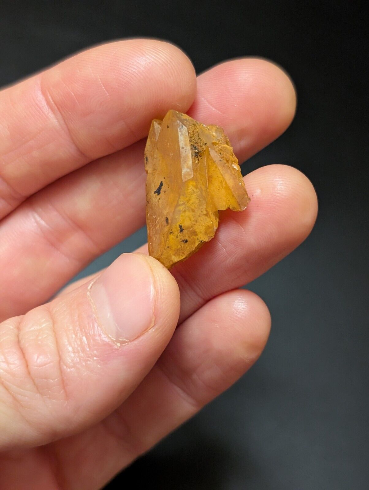 Translucent, yellow-orange crystal cluster.