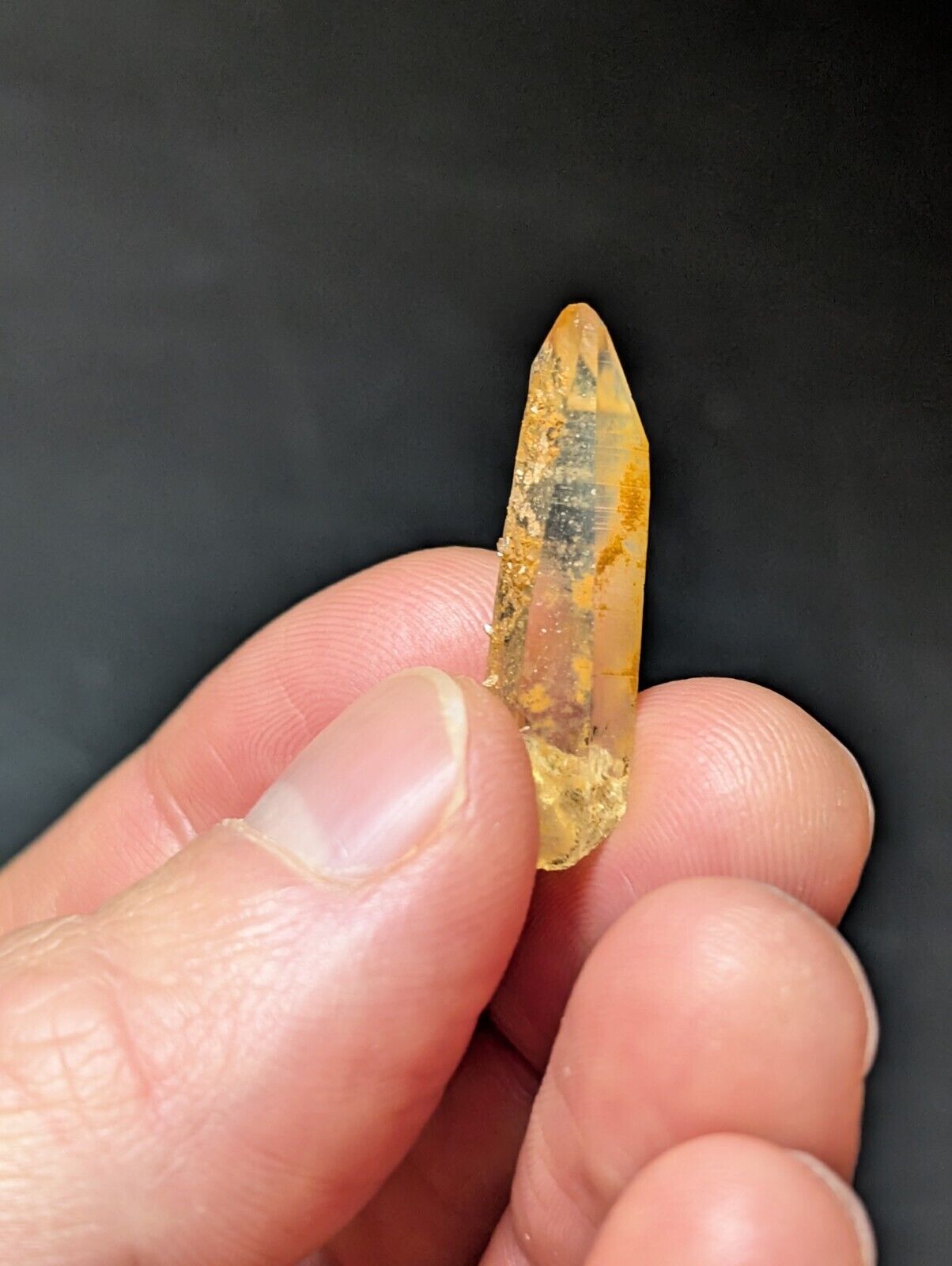 Translucent yellow crystal point.