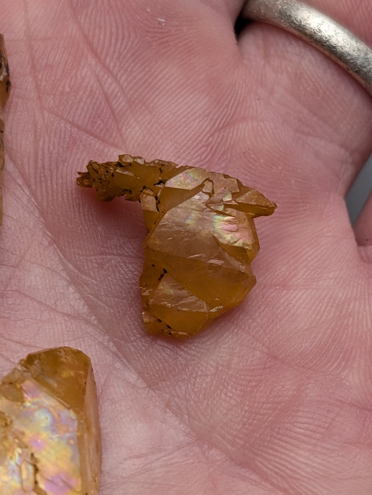 A translucent golden-yellow arkansas quartz crystal with jagged edges and natural iridescence in a set of 3 unique pieces