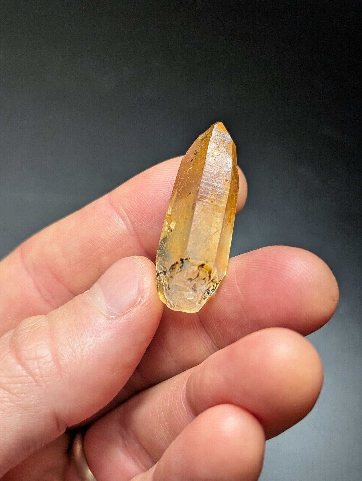 Translucent yellow crystal point.