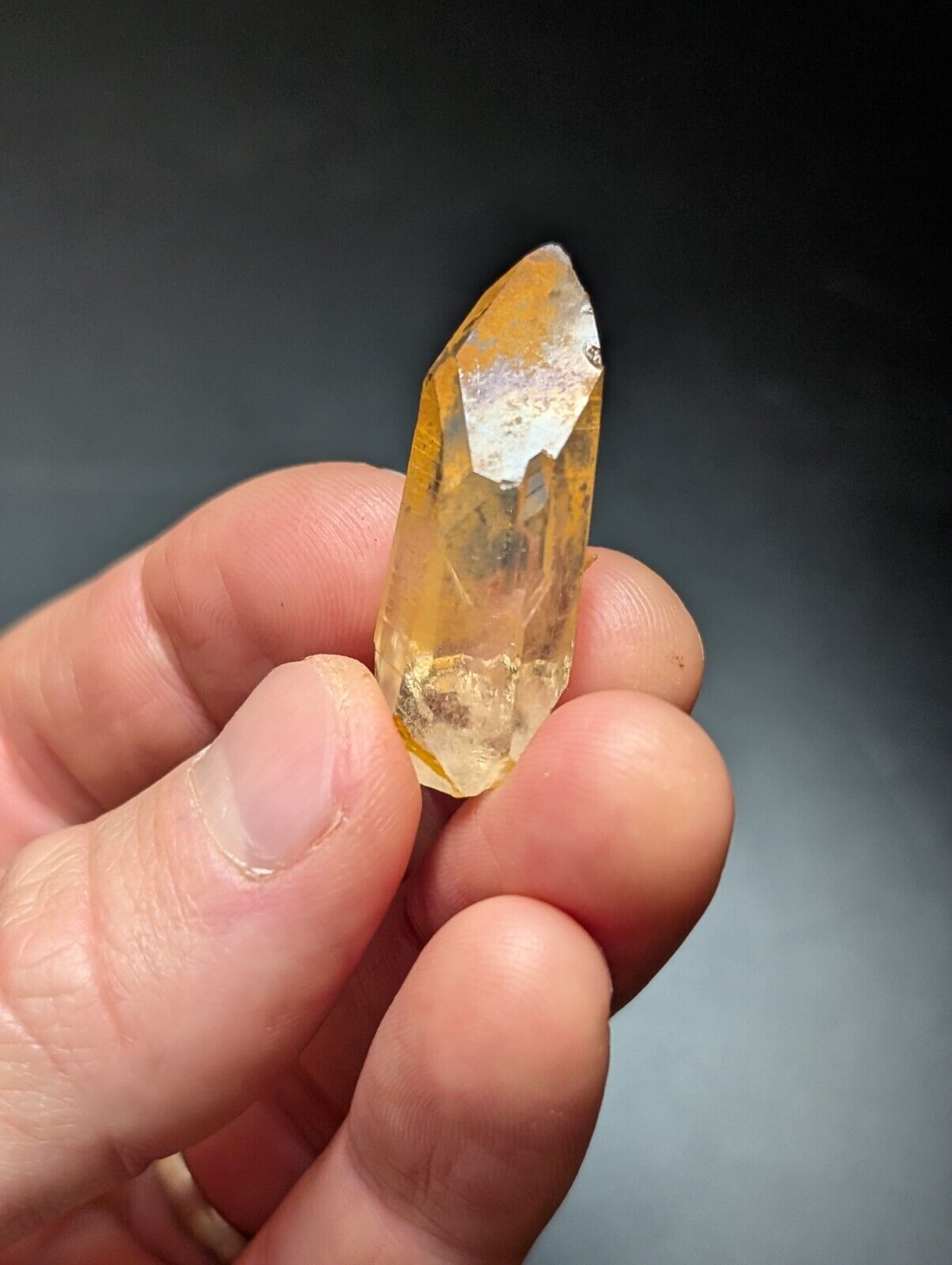 Translucent orange crystal point.