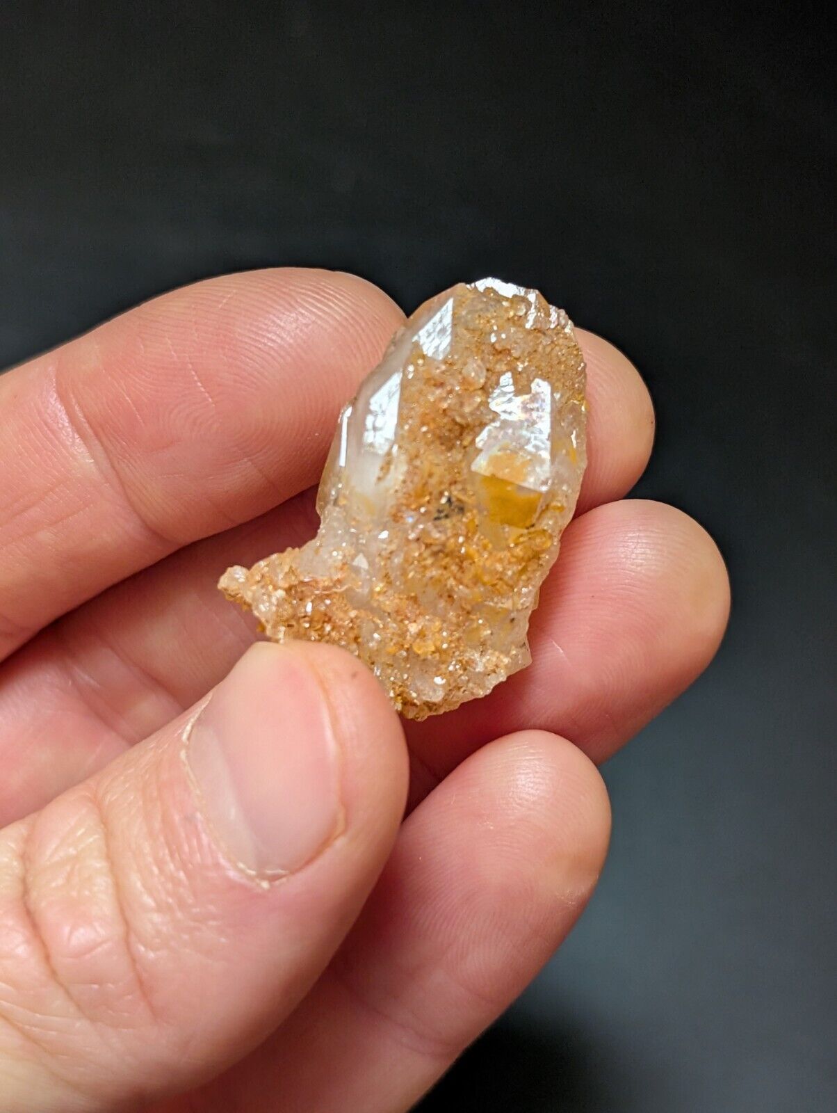 Quartz crystal with sandy coating.