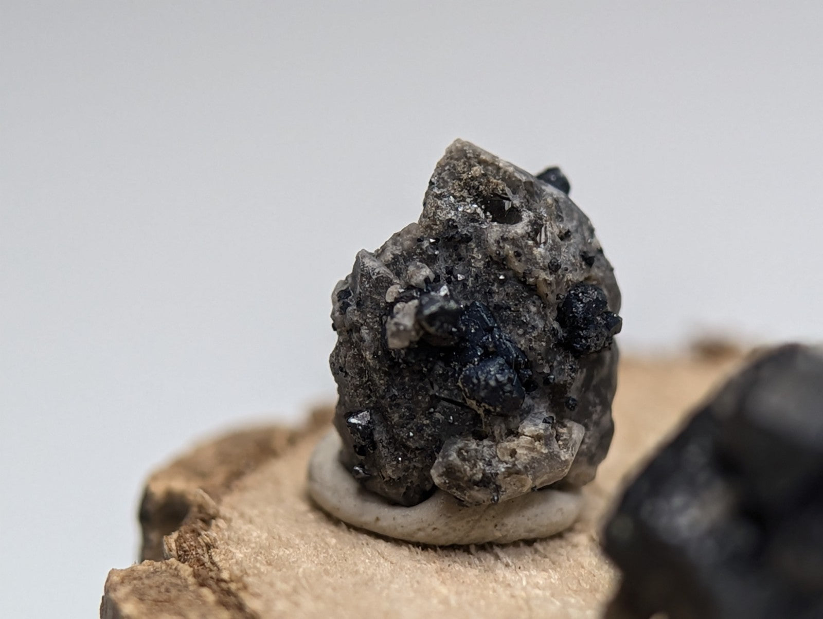 Set of 3 brookite and smoky quartz mineral specimens from magnet cove arkansas with dark gray rough texture and black crystals