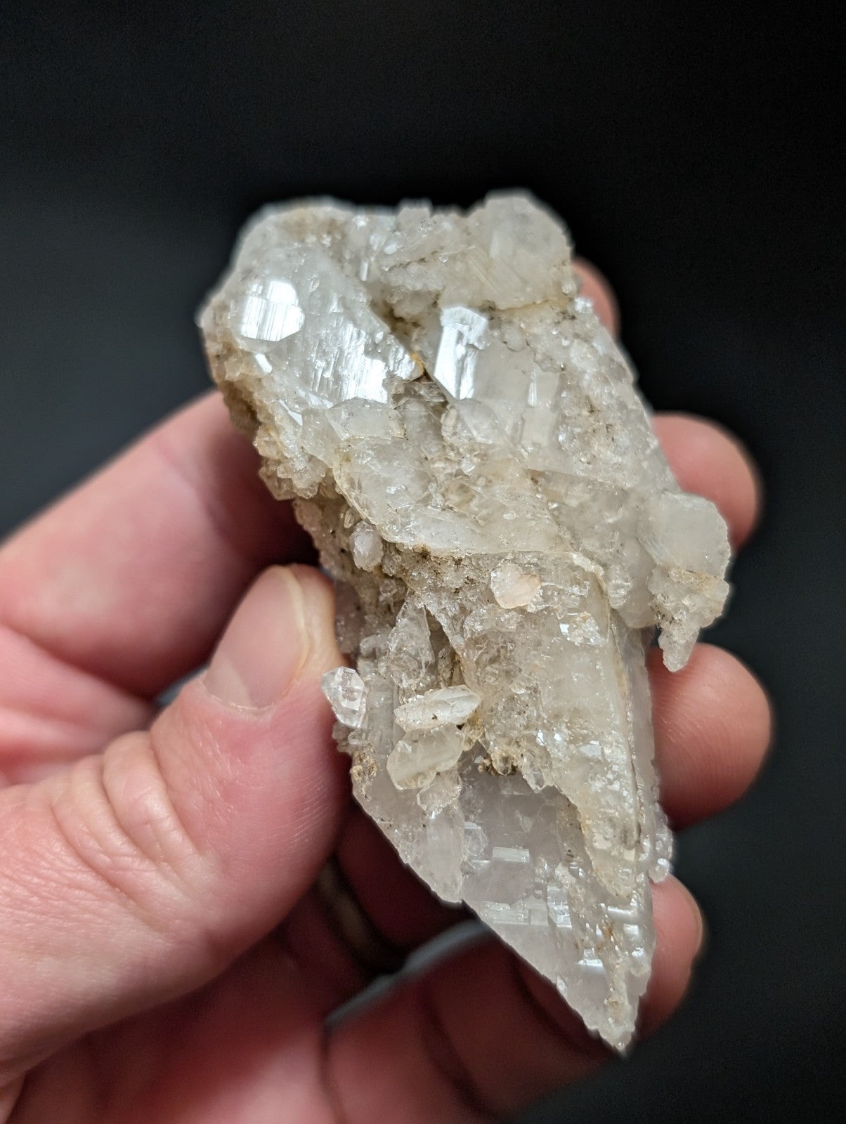 A translucent, crystalline quartz specimen with sharp facets and a pale, milky white hue.