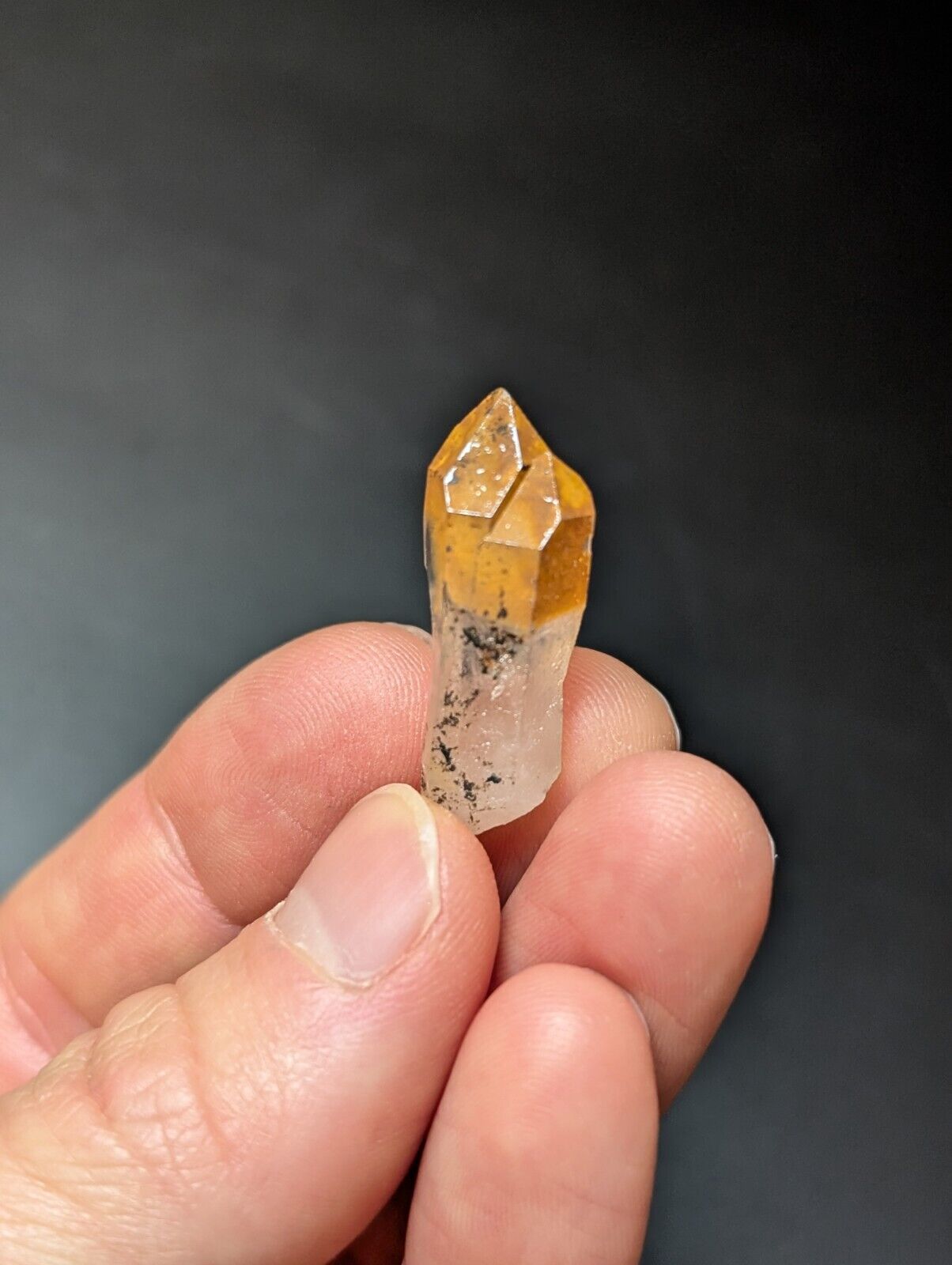 Quartz crystal with golden tip.