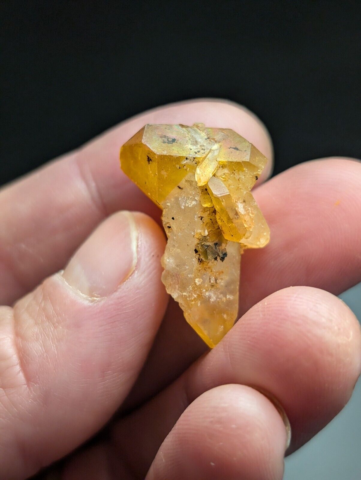 Yellowish-orange crystal formation.