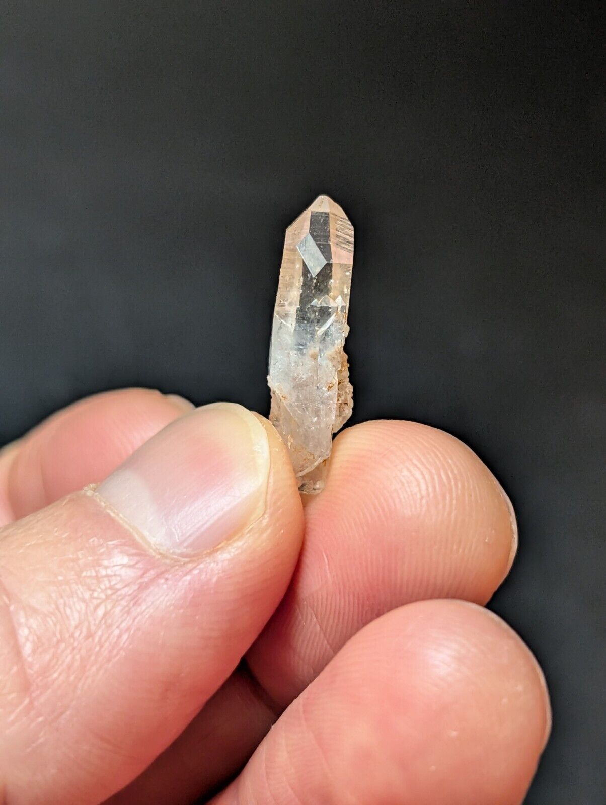 Translucent quartz crystal point.