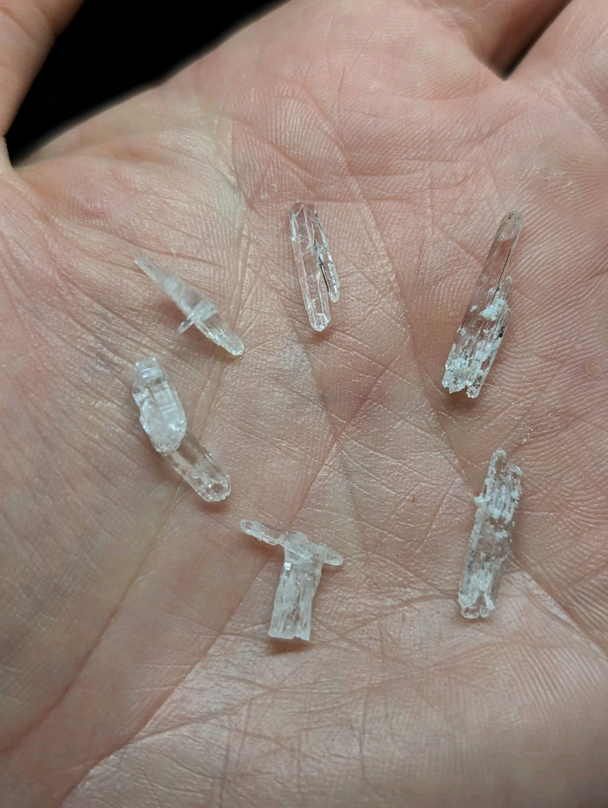 Clear, translucent crystal fragments with natural facets and slight imperfections.