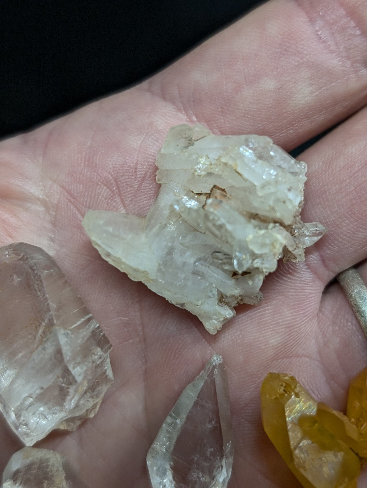 A translucent, pale quartz crystal cluster with sharp facets and a slightly cloudy appearance.