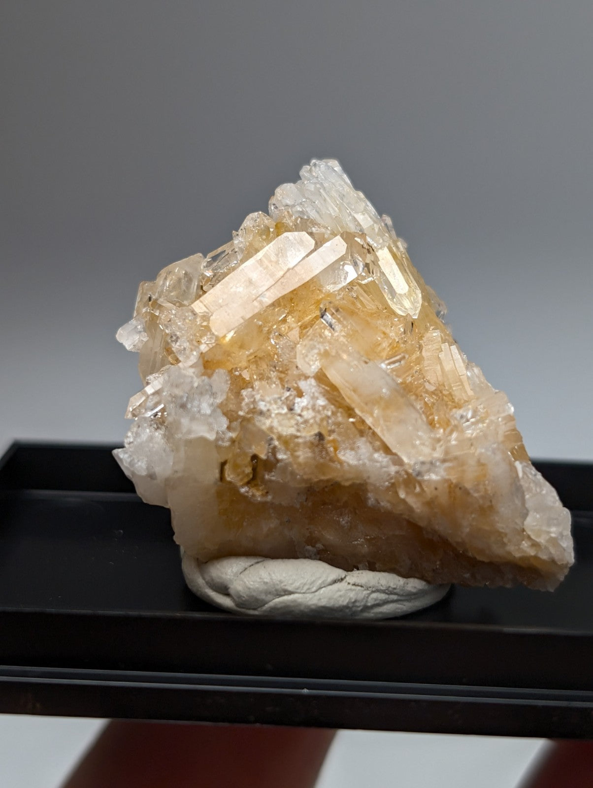 Solution quartz crystal cluster with translucent amber-colored quartz points on a rough base from saline county arkansas