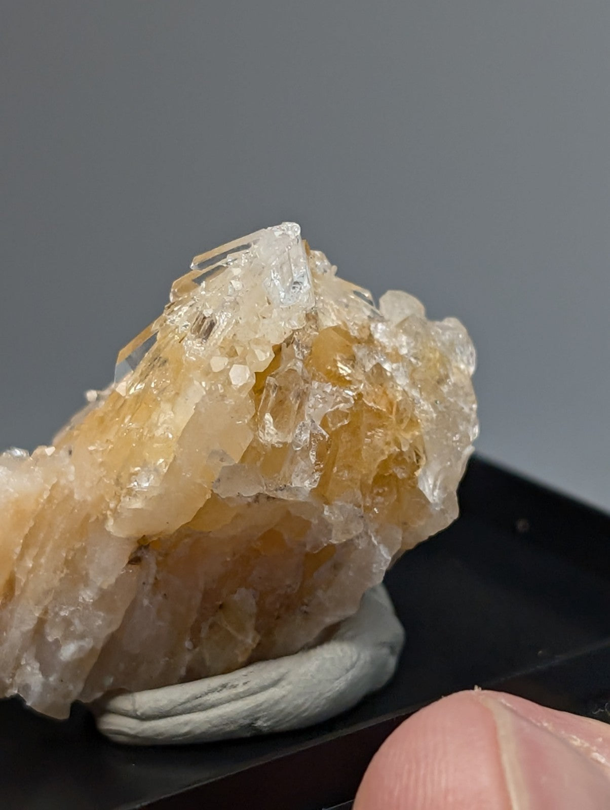 Solution quartz crystal cluster with translucent amber and clear faceted crystals on a rough jagged surface from saline county arkansas