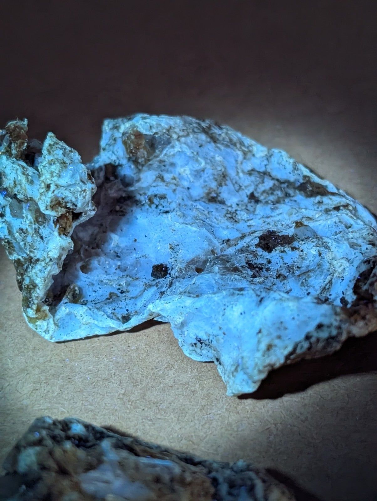 A rough blue solution quartz in rectorite with brown and black veining from Jeffrey Quarry Arkansas ex Delinde