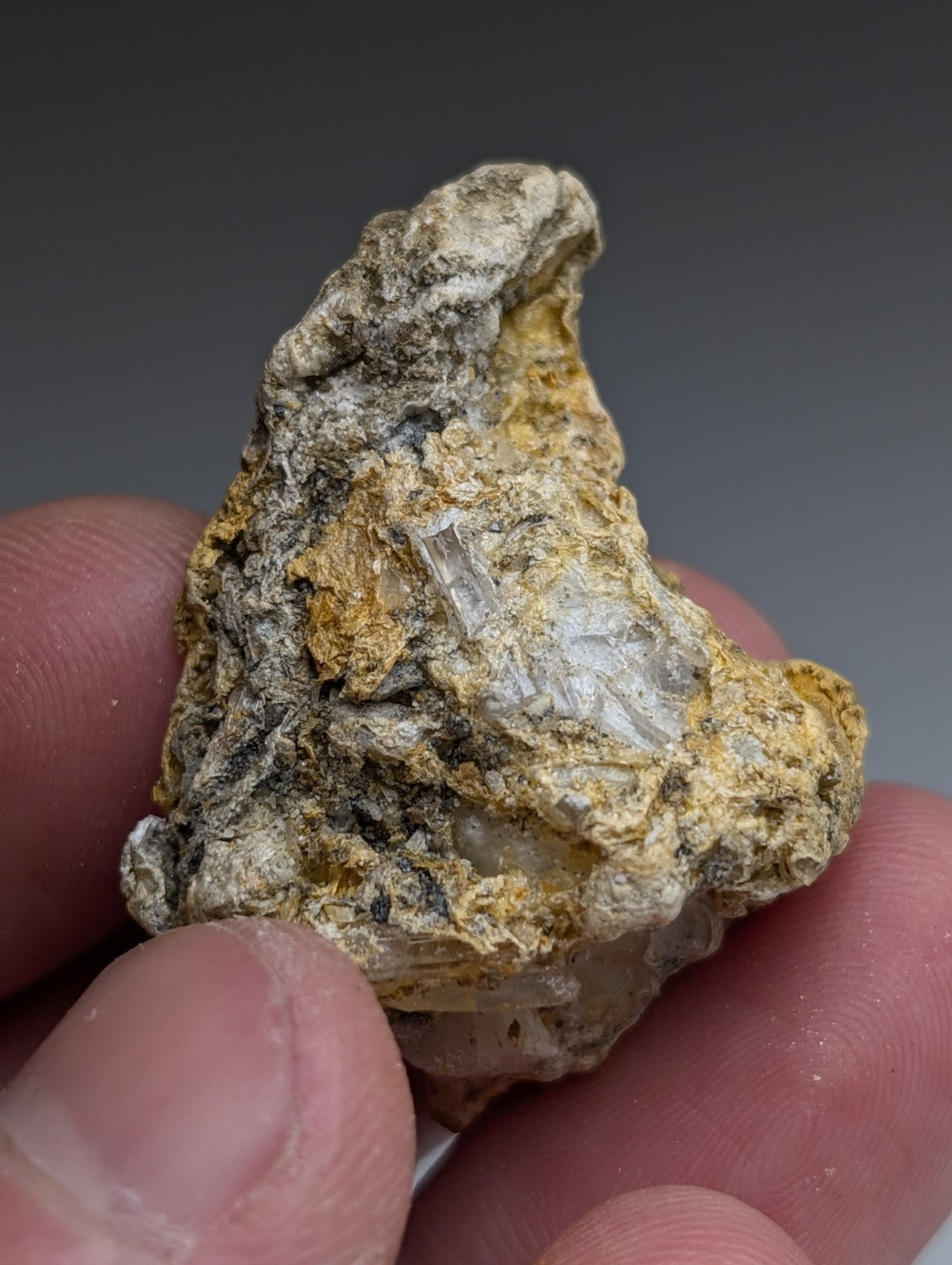 Solution quartz in rectorite mineral specimen with gray white and yellow hues and translucent crystals from jeffrey quarry arkansas