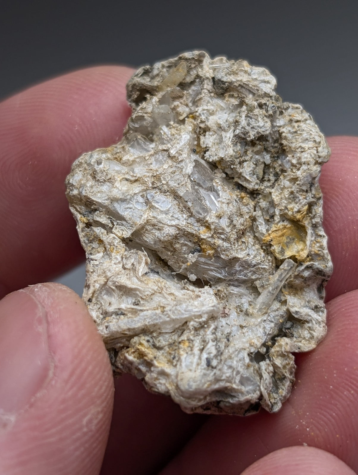 Solution quartz in rectorite with translucent white crystals and yellow flecks in a gray matrix from jeffrey quarry arkansas