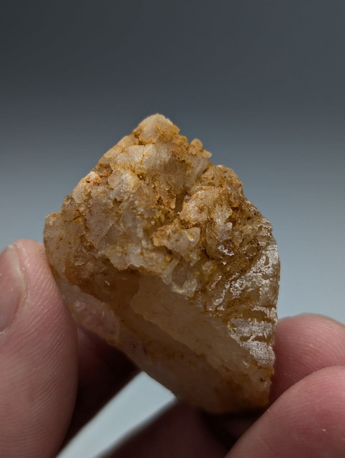 Unique dissolution quartz crystal point translucent pale yellow with golden-brown mineral coating from garland county arkansas